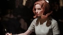The Queen's Gambit Season 2 Netflix Image: Anya Taylor-Joy as Beth Harmon in The Queen's Gambit with a chessboard