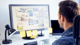 JPG vs. JPEG: Understanding the Difference

Stock Image: Man looking at images on a computer