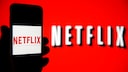 Netflix Ad-Supported Subscription: Netflix logo on a red background and on a smartphone