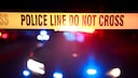 Symbolic image True Crime Netflix: barrier tape in front of police car