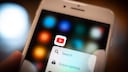 Smartphone screen with the YouTube app icon