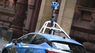 Blue Google Street View car with a camera on the roof