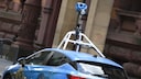Blue Google Street View car with a camera on the roof