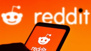 Smartphone with Reddit icon on an orange background