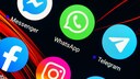 WhatsApp Update Design: Symbolic Image Shows WhatsApp Icon on Phone Next to Facebook Messenger and Telegram