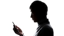 Apps Tricks: Silhouette of a Man with Smartphone
