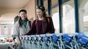 Customers Unlocking a Shopping Cart