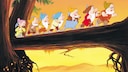Excerpt from the Disney film "Snow White and the Seven Dwarfs," showing the dwarfs running across a log bridge.