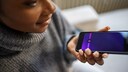 Woman speaks into smartphone