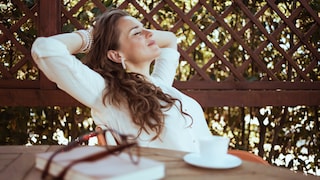 Digital Detox: A Woman Relaxing With a Cup of Coffee