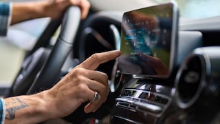Man in Car Operates a Touchscreen