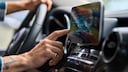 Man in Car Operates a Touchscreen