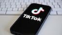 Smartphone with TikTok logo on a table.