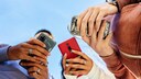User-Friendly Apps: Low-Angle View of Three People with Smartphones