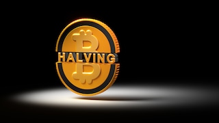Bitcoin with Halving Inscription Against Black Background