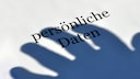 Shadow of a hand over the words "personal data."