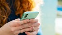 On the iPhone, the time can appear in color.