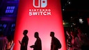 Switch Successor: Console Logo Displayed at Event Against Red Background