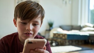 Child Browses the Internet on Smartphone