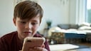 Child Browses the Internet on Smartphone