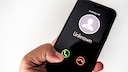 Unknown Caller on a Cell Phone Display.