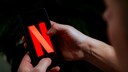 Netflix logo on a smartphone.