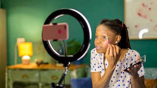 Stock Image: Woman Recording Makeup Video for TikTok