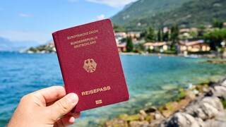 Stock Photo: German Passport in Front of Lake Garda