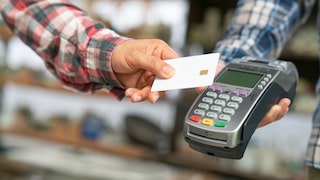 Man uses card payment in the store.