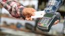 Man uses card payment in the store.