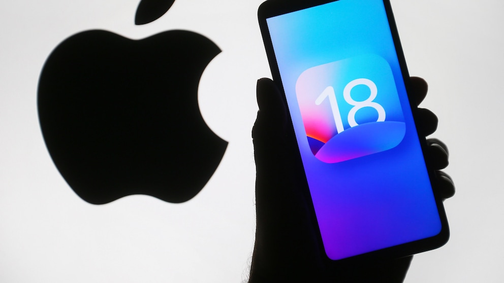 Apple logo and iOS 18 icon on a cell phone display