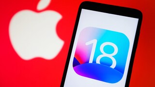 Apple logo and the number 18 on a cell phone display.