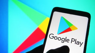 Google Play Store logo on a cell phone and in the background