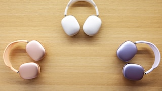 Different color variants of the AirPods Max on a table