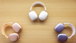 Different color variants of the AirPods Max on a table