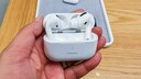 Person holding AirPods Pro in the store