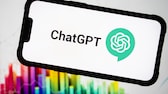 ChatGPT logo on a smartphone with colors in the background