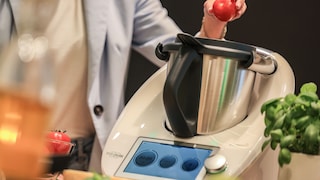 Woman operating a Thermomix TM6