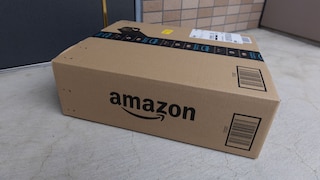 An Amazon package in front of a doorstep