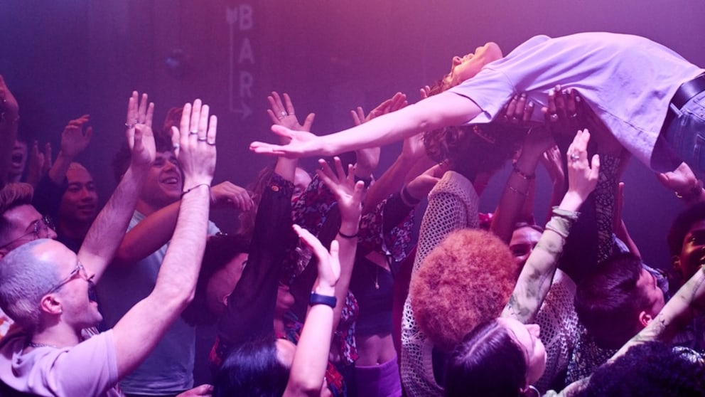 Man Crowd Surfs at a Concert