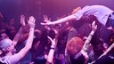 Man Crowd Surfs at a Concert