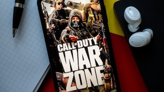Logo for "Call of Duty: Warzone" on a smartphone