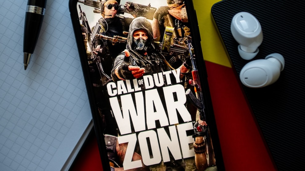 Logo for "Call of Duty: Warzone" on a smartphone