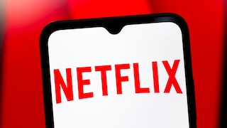 Netflix logo on a smartphone with a red background