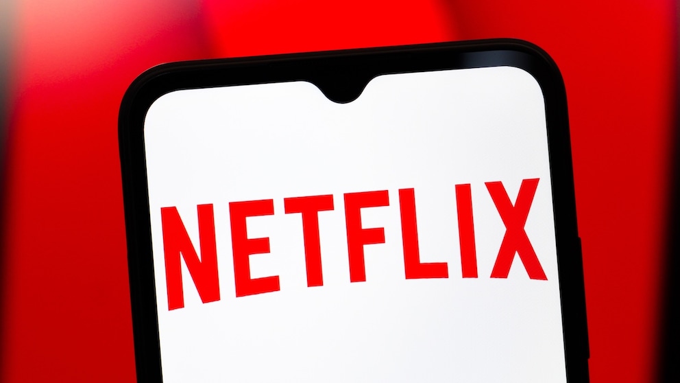 Netflix logo on a smartphone with a red background