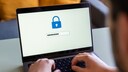 Person Enters Password on Laptop