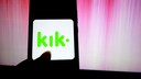 Kik Messenger logo on a smartphone