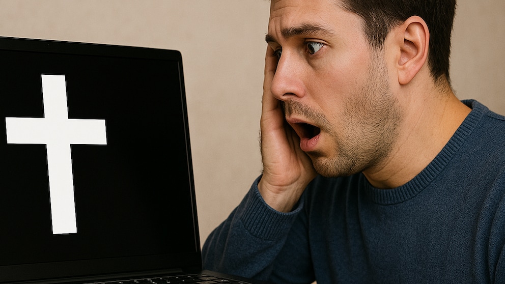 Man Looks Horrified at a Laptop