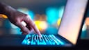 Person typing on a laptop keyboard
