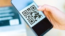 A QR code on a smartphone